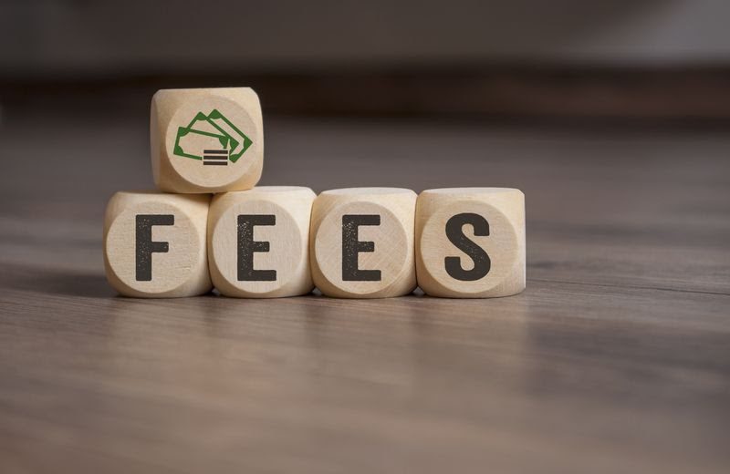 eCommerce bookkeeping services - fees concept in wooden cubes