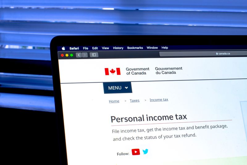 cerb income tax amount - canadian personal income tax page on laptop 